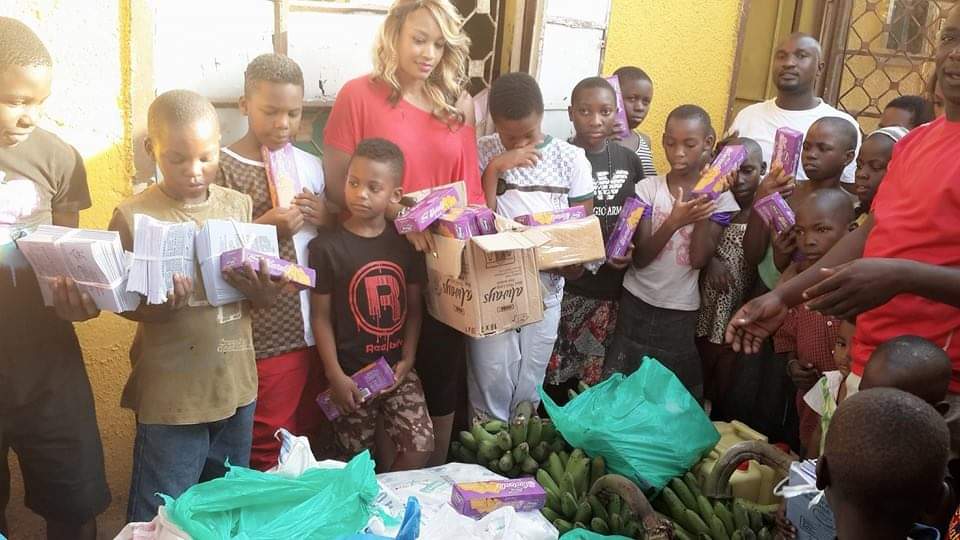 Children receiving essential care packages during a foundation visit