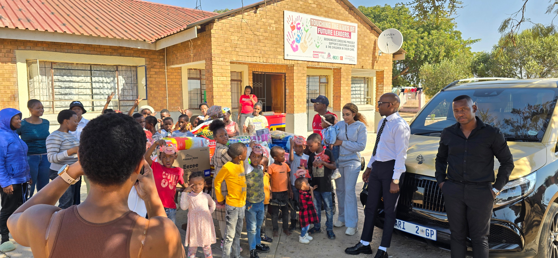 Zari Foundation team and beneficiaries gathered at a community distribution event in South Africa